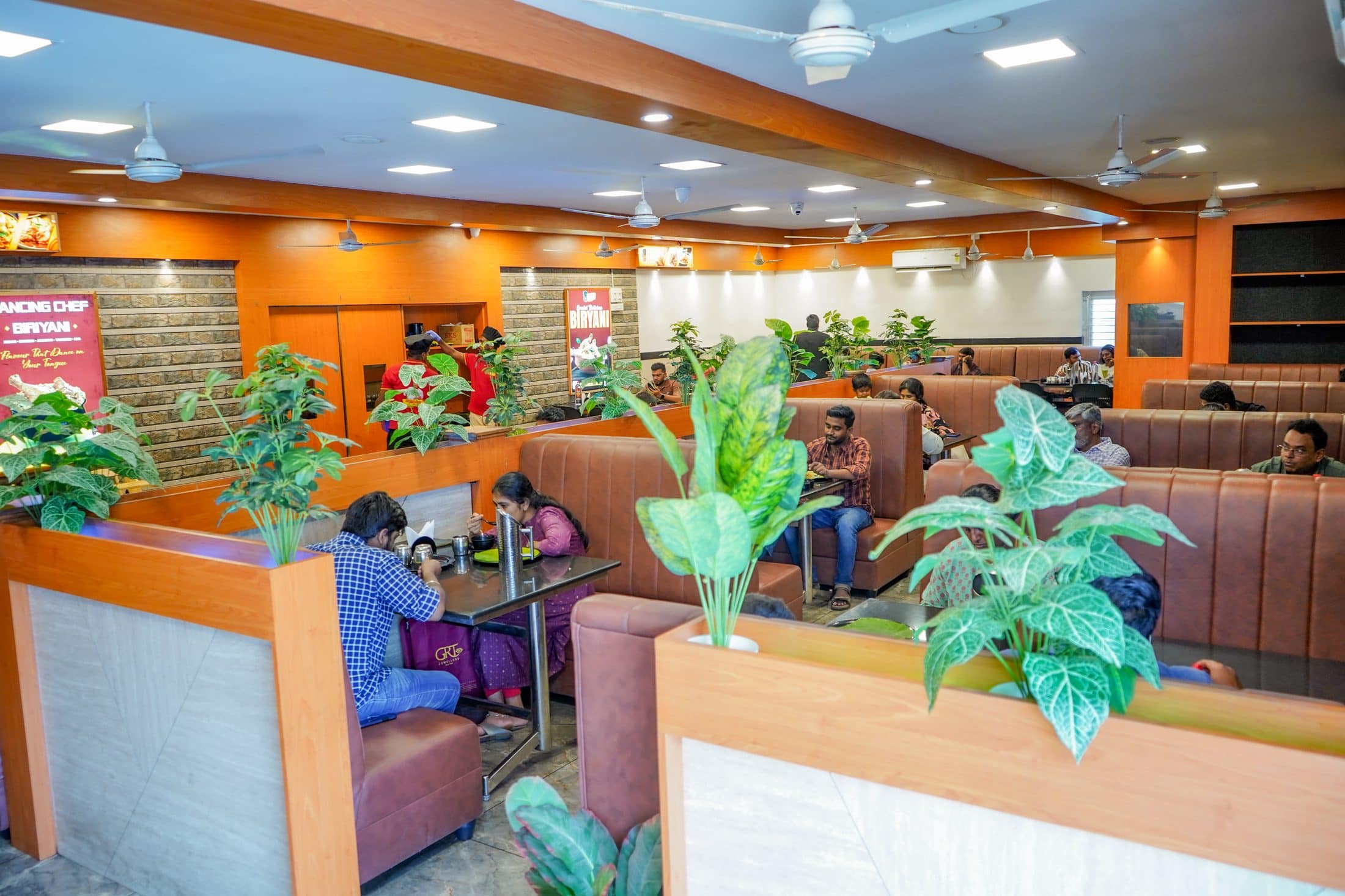 Guests in the booths of the Dancing Chef Biriyani dining hall